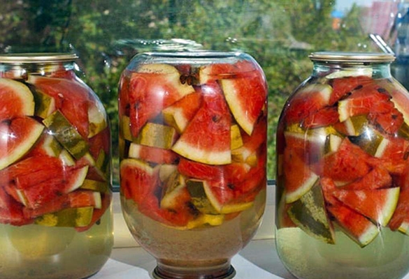 jars of pickled watermelons on the windowsill