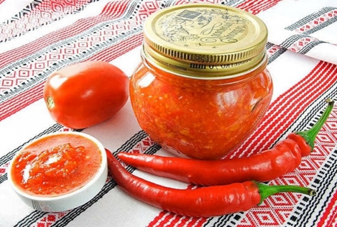 Adjika spicy Abkhaz in a jar on the table