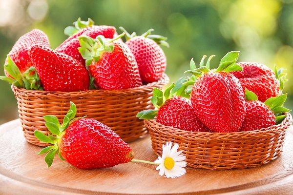 strawberries on the table in a basket